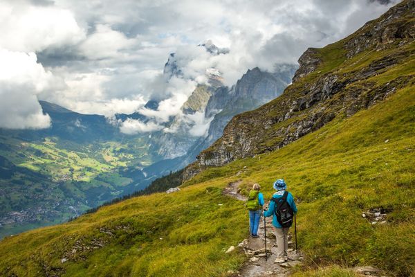 Hikers on the Eiger trail in Lauterbrunnen, Switzerland.jpg
